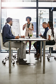 Let Me Try And Explain. Shot Of Businesspeople In An Office.