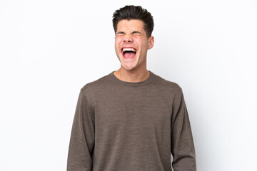 Young handsome caucasian man isolated on white bakcground shouting to the front with mouth wide open