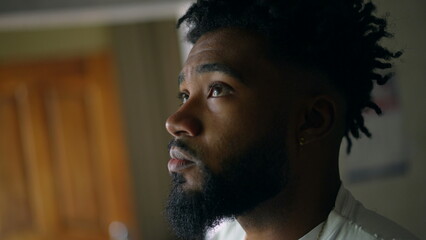 Pensive young man thinking about life a thoughtful African American