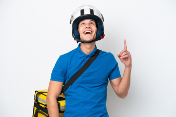 Young caucasian man with thermal backpack isolated on white background pointing up and surprised