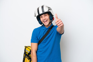 Young caucasian man with thermal backpack isolated on white background with thumbs up because something good has happened