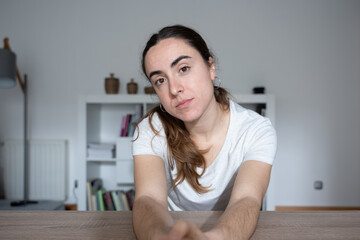 Webcam view of young female student paying attention to online class