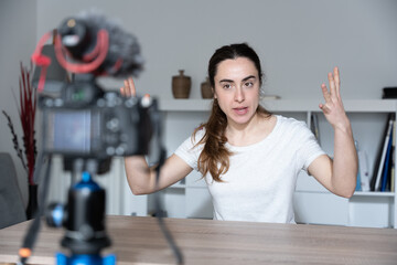 Young woman recording a tutorial or content for social media.