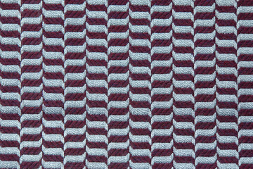Knitted texture. Texture of jacquard fabric with gray blue geometric pattern. Crochet mosaic...