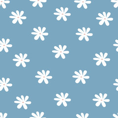 Fototapeta na wymiar Spring cute flowers seamless pattern. Beautiful floral background. Simple botanical vector print. Abstract white daisies on a blue background.