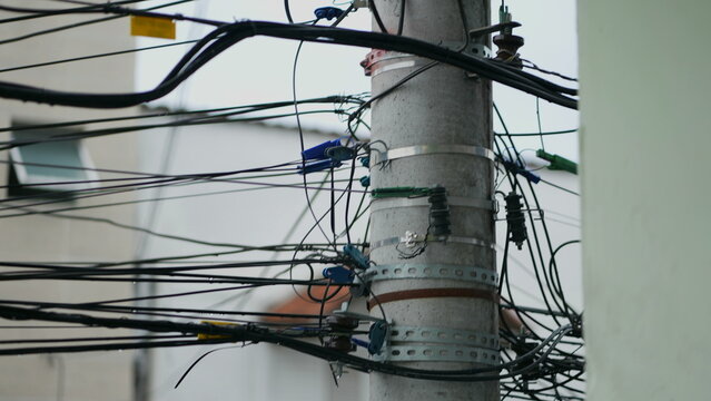 Electric Pole With Wires In Third World Country