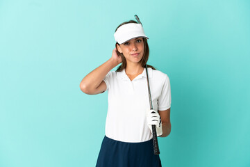 Woman playing golf over isolated blue background having doubts