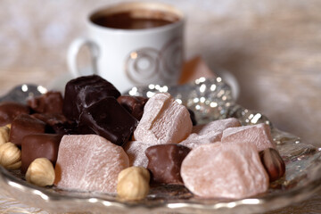 Turkish delight and Turkish coffee on a white wooden background. holiday candy