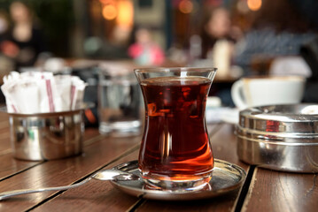 Hot black tea service in glass or porcelain cups