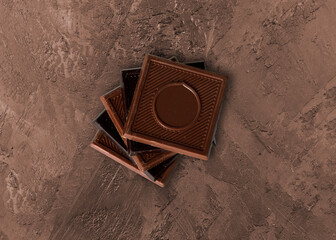 Milk and dark square chocolate Madlen is designed geometrically. Candy Day or any festival celebration. top view