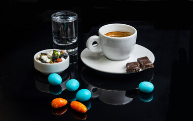 Obraz na płótnie Canvas Coffee and cream service in cafe, restaurant, bar, home Coffee beans, chocolate, candies