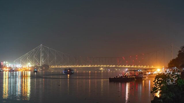 Howrah bridge on the river Hooghly with the twilight sky. The cantilever bridge is considered the busiest bridge in India.