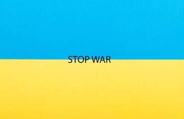 Flag of Ukraine with inscriptions Stop War. Slogan calling to stop Putin and the war written in the...