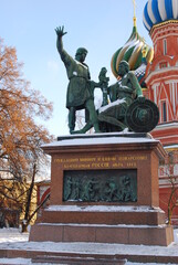 Fototapeta na wymiar Monument to Minin and Pozharsky and Saint Basils cathedral on the Red Square in Moscow in winter