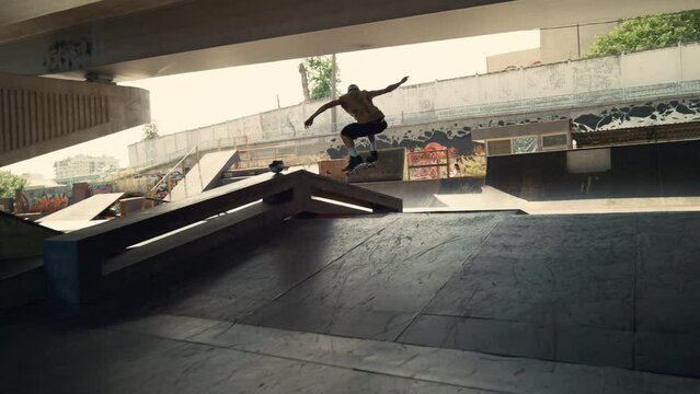 Energetic skater performing trick during freestyle session at skate park. 