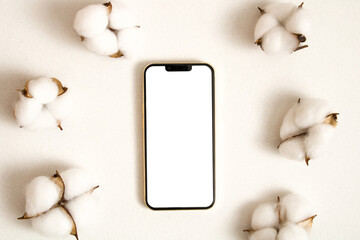 Mobile phone mockup with cotton leaves on the white background
