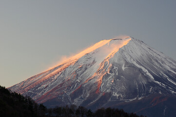 Mount Fuji, glowing red in the morning sun