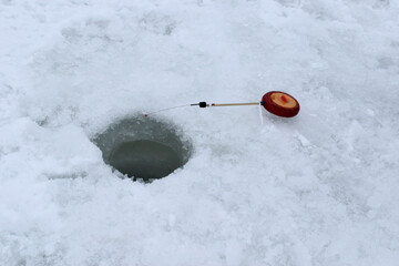 Fishing on ice in winter