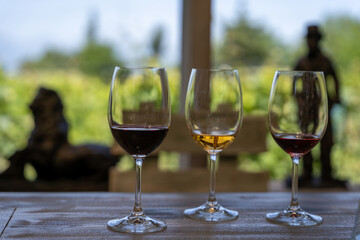 wine testing at a table with empty glasses left in some with some wine