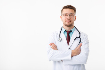 Fototapeta premium Portrait of confident young medical doctor on white background.