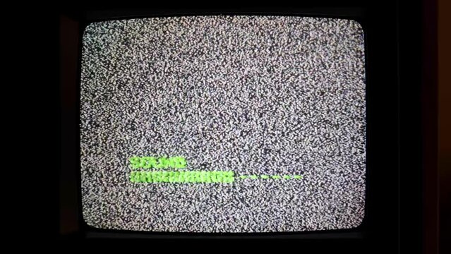 Volume up, turning up audio, loud loud music and loudness abstract concept. Old retro CRT TV screen in an empty black dark room, static noise texture, crt television, end of broadcast cut transmission