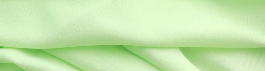 Smooth elegant green satin silk background. Copy space for text anniversary christmas background