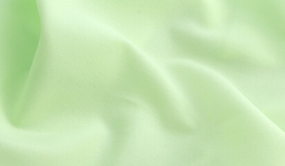 Smooth elegant green satin silk background. Copy space for text anniversary christmas background