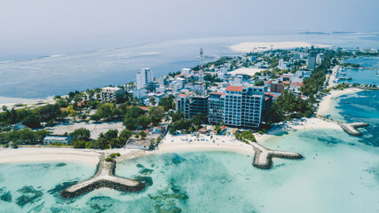 Aerial View to the Maafushi (Kaafu Atoll) Paradise Island with Blue Ocean Water and Paradise Coastline, Maldives