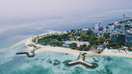 Aerial View to the Maafushi (Kaafu Atoll) Paradise Island with Blue Ocean Water and Paradise Coastline, Maldives