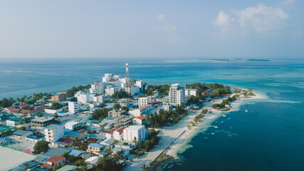 Aerial View to the Maafushi (Kaafu Atoll) Paradise Island with Blue Ocean Water and Paradise Coastline, Maldives