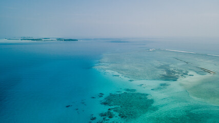 Aerial View to the Maafushi (Kaafu Atoll) Paradise Island with Blue Ocean Water and Paradise Coastline, Maldives