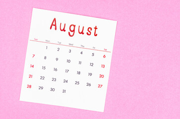 August 2022 calendar on pink background with empty space.