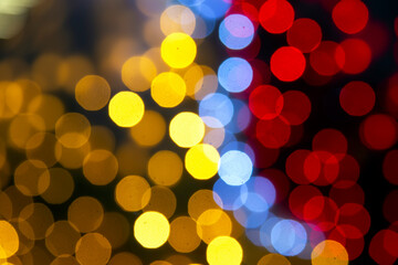 background blurred abstraction of colored lanterns and decorations. bokeh texture of street colored lights