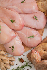 Fresh chicken platter from different parts of chickens - thighs, legs, wings. Assorted raw meat.
