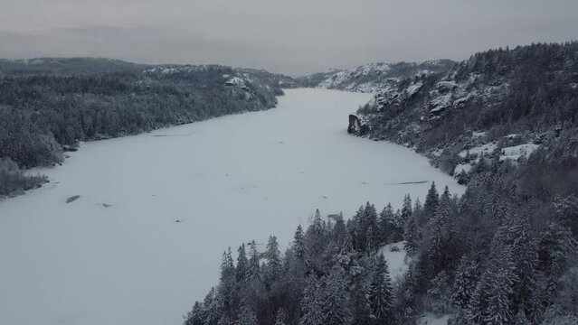 Downward Soaring above the Dingle Dam Sweden Snow Mountain 4K 30fps