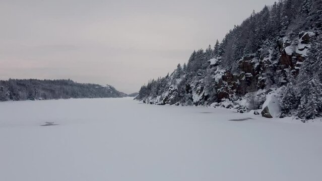 Upward Soaring above the Dingle Dam Sweden Snow Mountain 4K 30fps