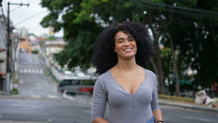 Fototapeta premium A happy Brazilian woman turning towards camera smiling
