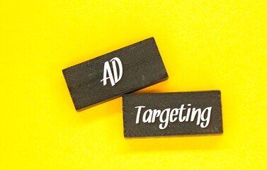 colored wooden boards with the word ad targeting. Target market concept