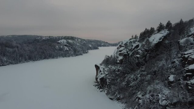 Scenic Dark Lake Dingle Dam Snow Covered Mountain Trees Sweden 4K 30fps