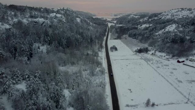 Landrover Driving Snowy Road 174 Nearing North Sea Sweden Sunset 4K 30fps