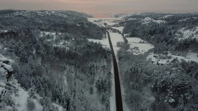 Landrover Cars Driving Snowy Road 174 Nearing North Sea Sweden Sunset 4K 30fps