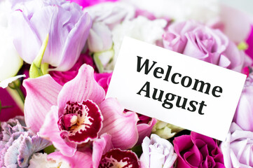 Welcome August inscription on the card against the background of flowers in a bouquet