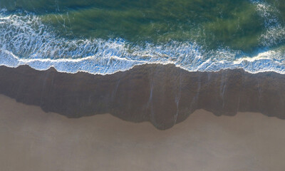 Fototapeta na wymiar Ocean Waves at the Water's Edge at Chatham, Cape Cod