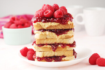 Sandwiches with peanut butter and raspberry jam