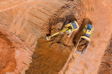 Excavation and loading onto dump trucks with excavators work construction equipment for earthworks