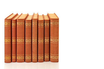 Brown vintage books with golden decorations isolated on white, clipping path, copy space