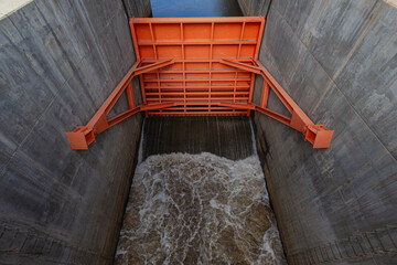 A large floodgate in a concrete dam.