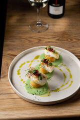 Gourmet cod fillet with, modern cuisine serving on a big dish, dark restaurant photo