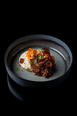 Shredded veal fillet with parsnip puree and crisps