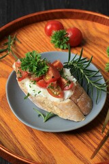 Bruschetta with sun dried tomatoes and arugula. Delicious breakfast or wine snack.